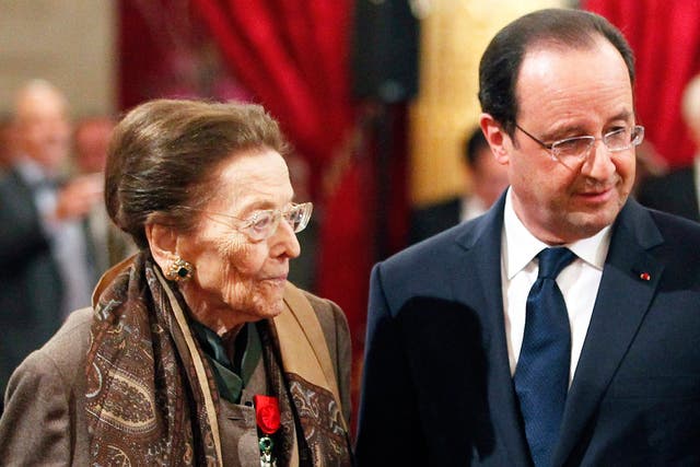 Charles-Roux with President Hollande during a ceremony at the Elysée Palace in Paris in 2014
