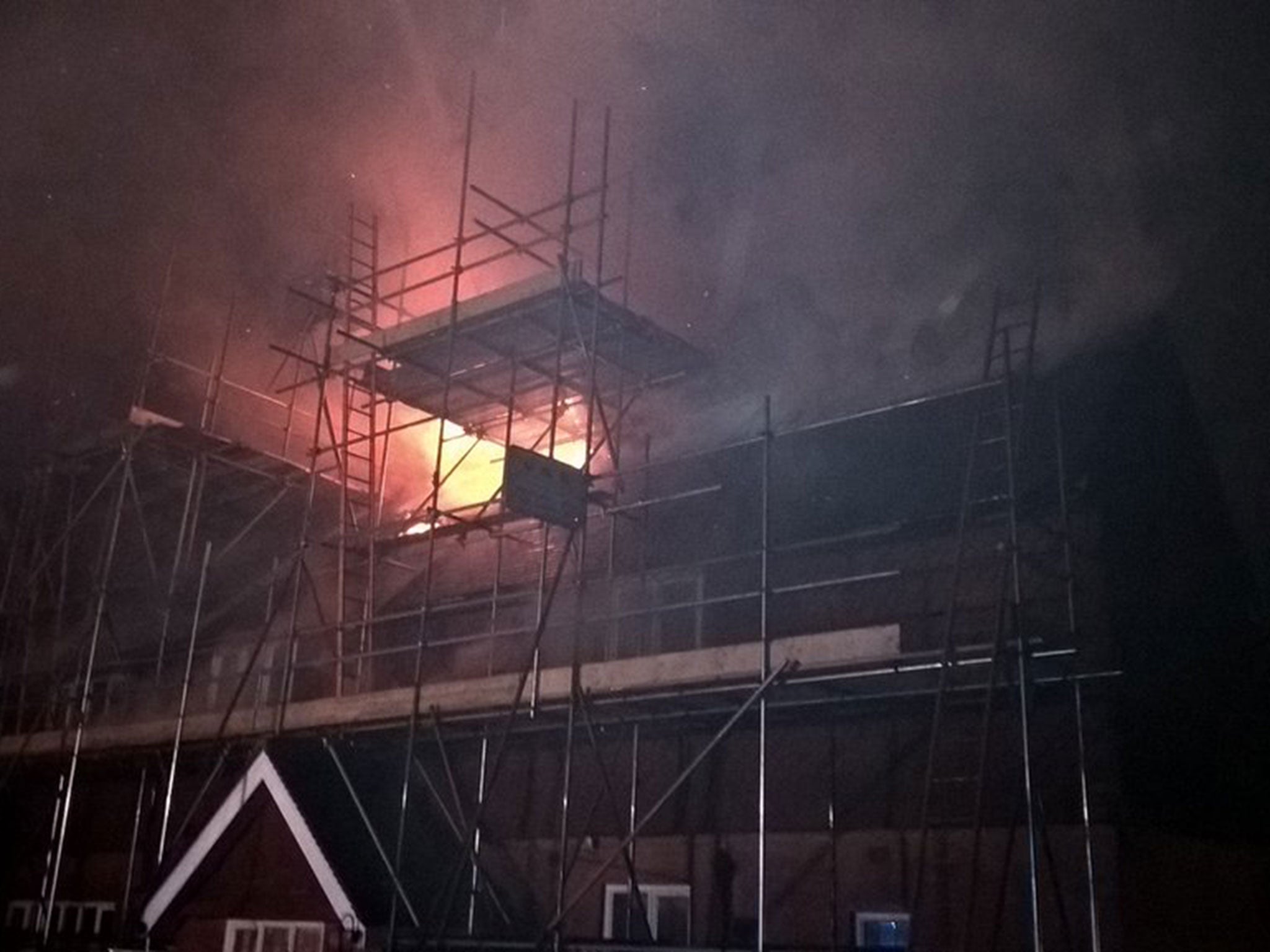The whole of the house's roof and the first floor are alight