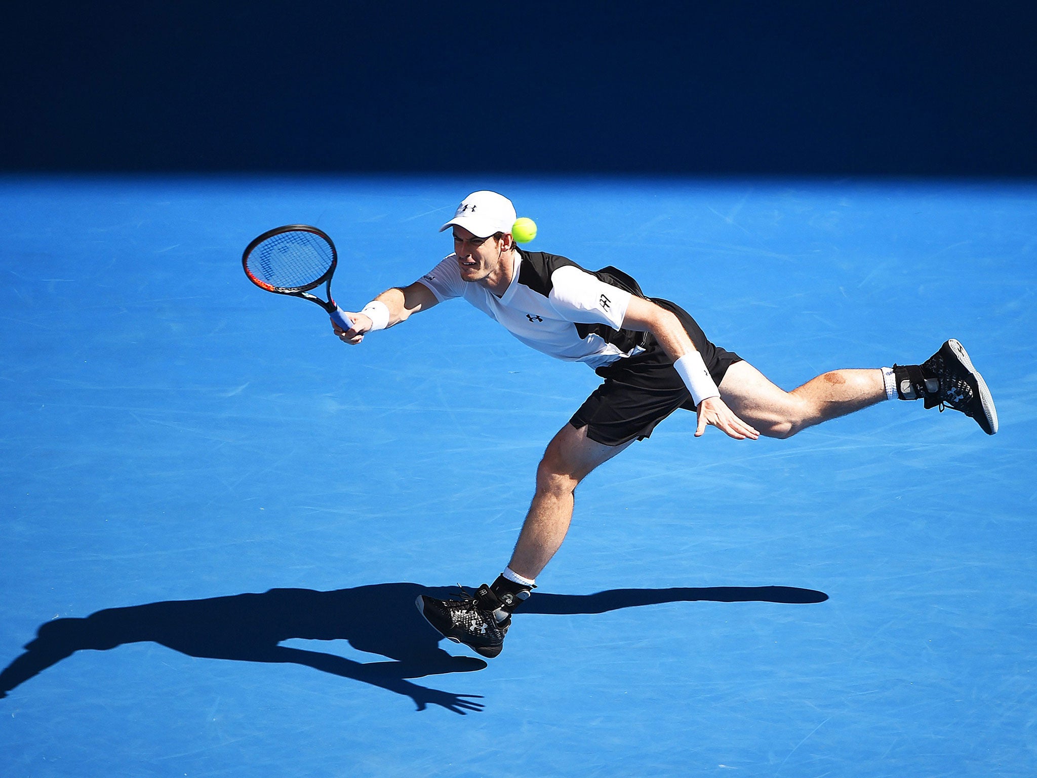 Andy Murray stretches to make a shot in his straight-sets win over Sam Groth