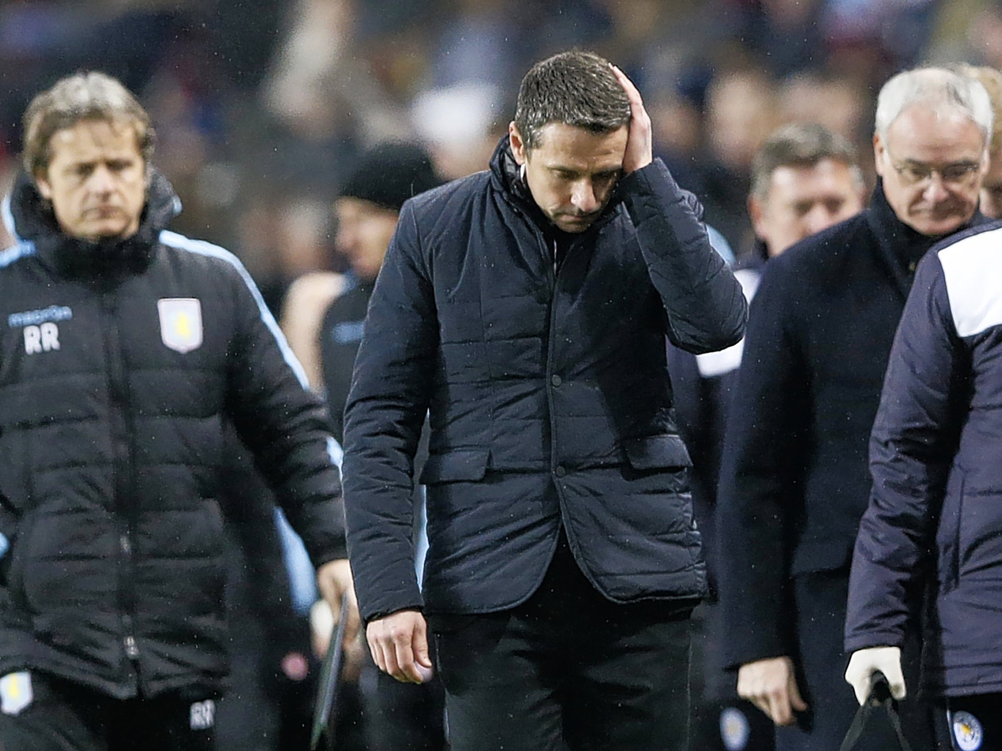 Rémi Garde (centre) shows the strain of a relegation battle during Villa’s recent game with Leicester