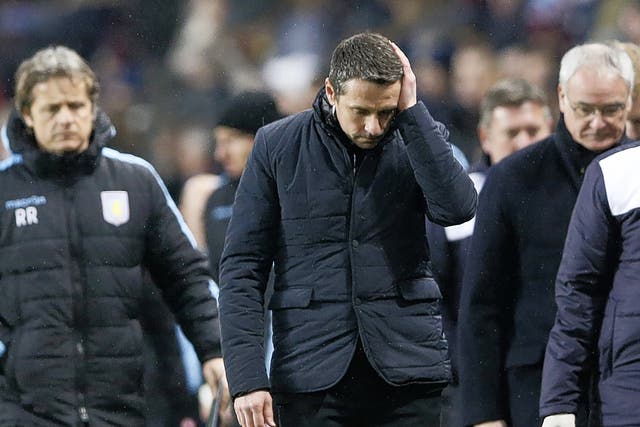 Rémi Garde (centre) shows the strain of a relegation battle during Villa’s recent game with Leicester