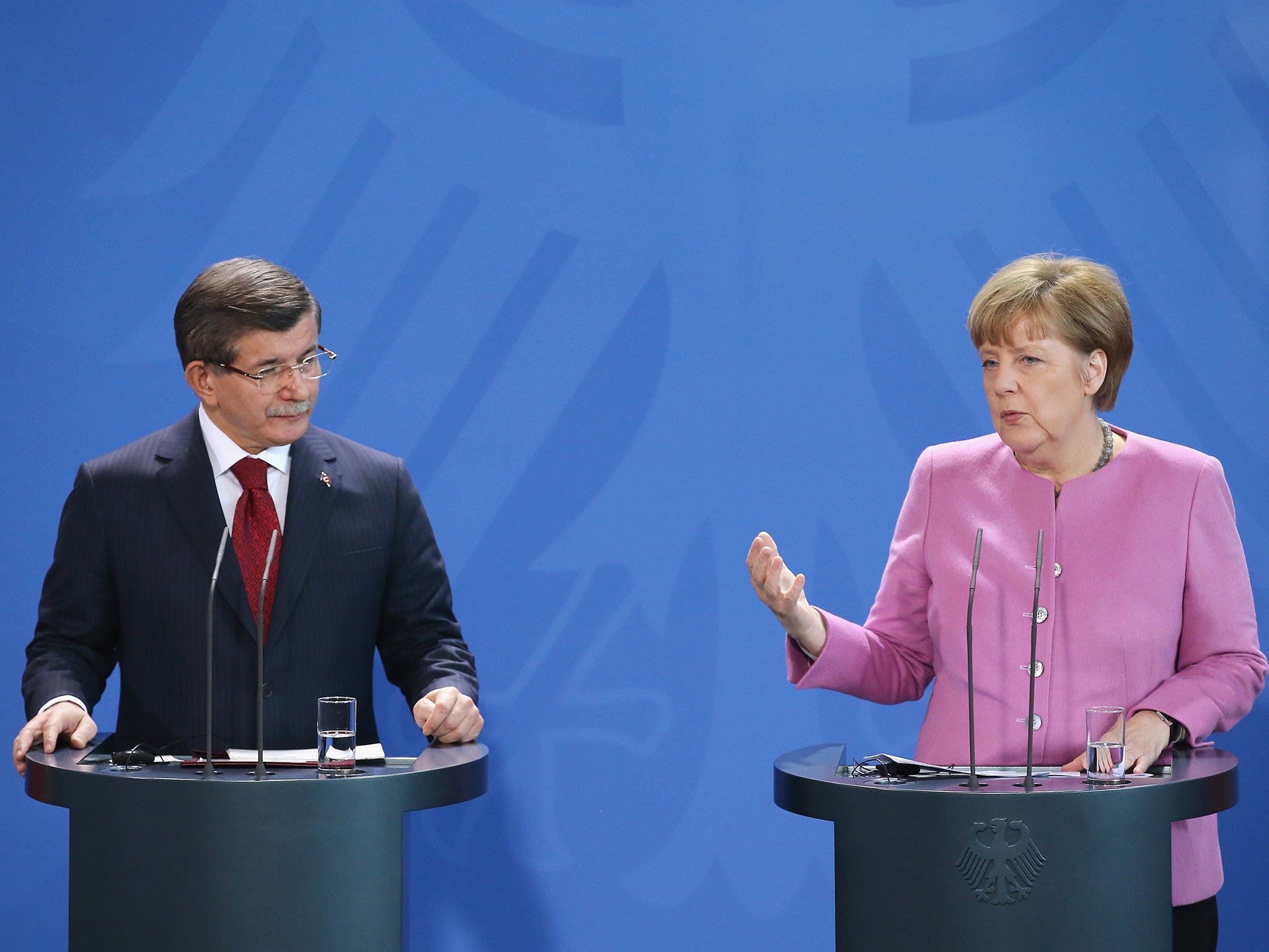 Turkish Prime Minister Ahmet Davutoglu and German Chancellor Angela Merkel speak to the media following German-Turkish government consultations. The two governments are meeting amidst Europe's need for cooperation from Turkey in stemming the flow of refugees and migrants seeking asylum in Europe.