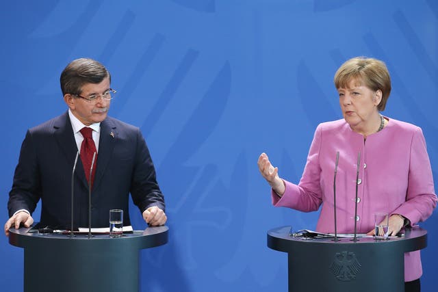 Turkish Prime Minister Ahmet Davutoglu and German Chancellor Angela Merkel speak to the media following German-Turkish government consultations. The two governments are meeting amidst Europe's need for cooperation from Turkey in stemming the flow of refugees and migrants seeking asylum in Europe.