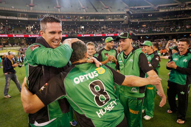 Kevin Pietersen and David Hussey of the Melbourne Stars embrace after winning the Big Bash League Semi Final match against the Perth Scorchers at Melbourne Cricket Ground.