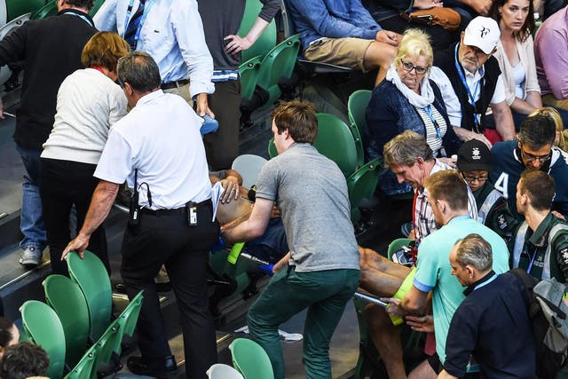 Nigel Sears is treated by medics after collapse