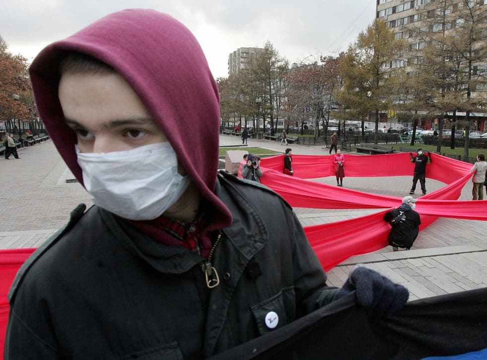 Russian FrontAIDS activists make a large Red Ribbon in Moscow