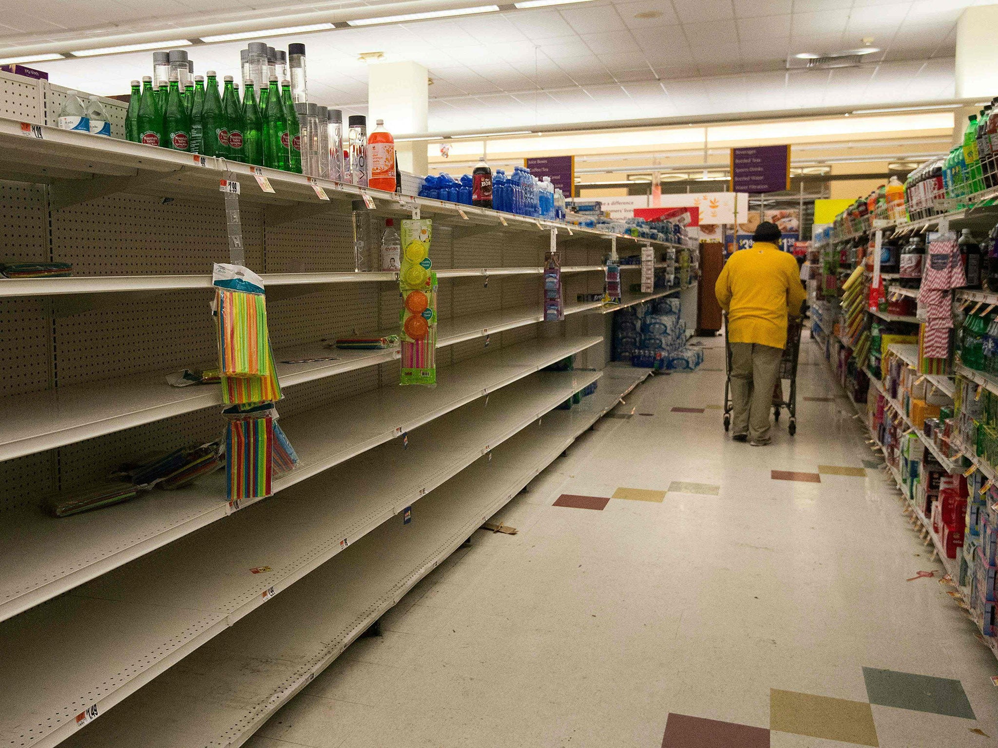 Empty shelves in a supermarket in Washington DC as it prepares for Storm Jonas