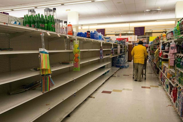 Empty shelves in a supermarket in Washington DC as it prepares for Storm Jonas