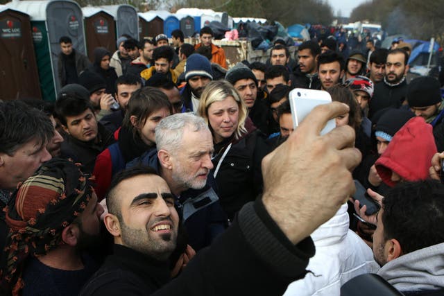 Jeremy Corbyn is surrounded by refugees at the Grande-Synthe camp near Dunkirk