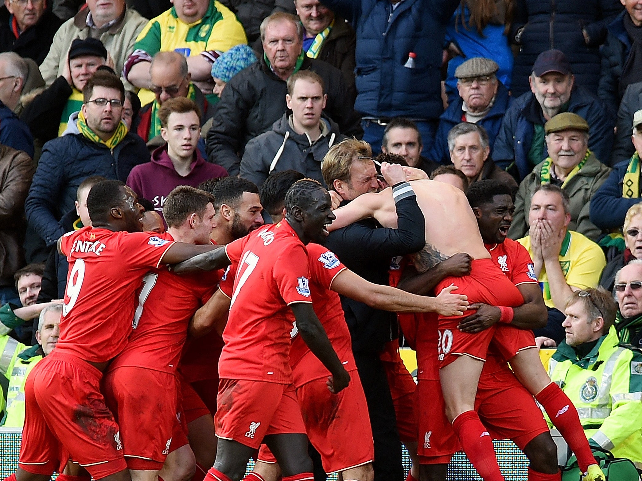 &#13;
Jurgen Klopp is mobbed by Reds stars &#13;