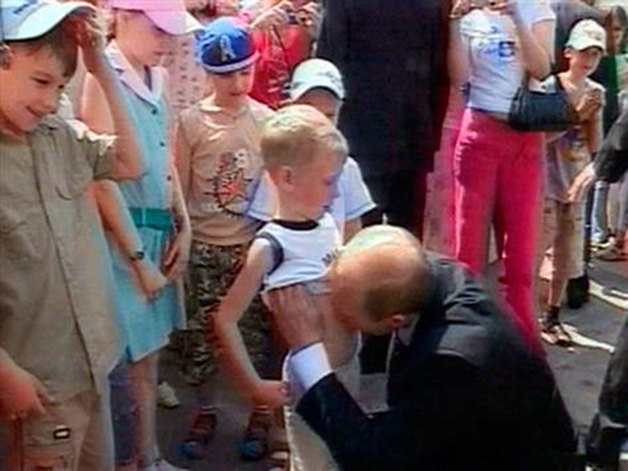 Putin kissing the stomach of Nikita Konkin in 2006