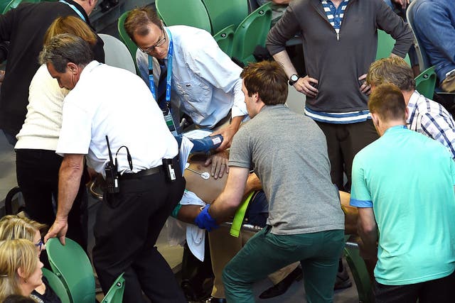 Nigel Sears is treated by medics after his collapse