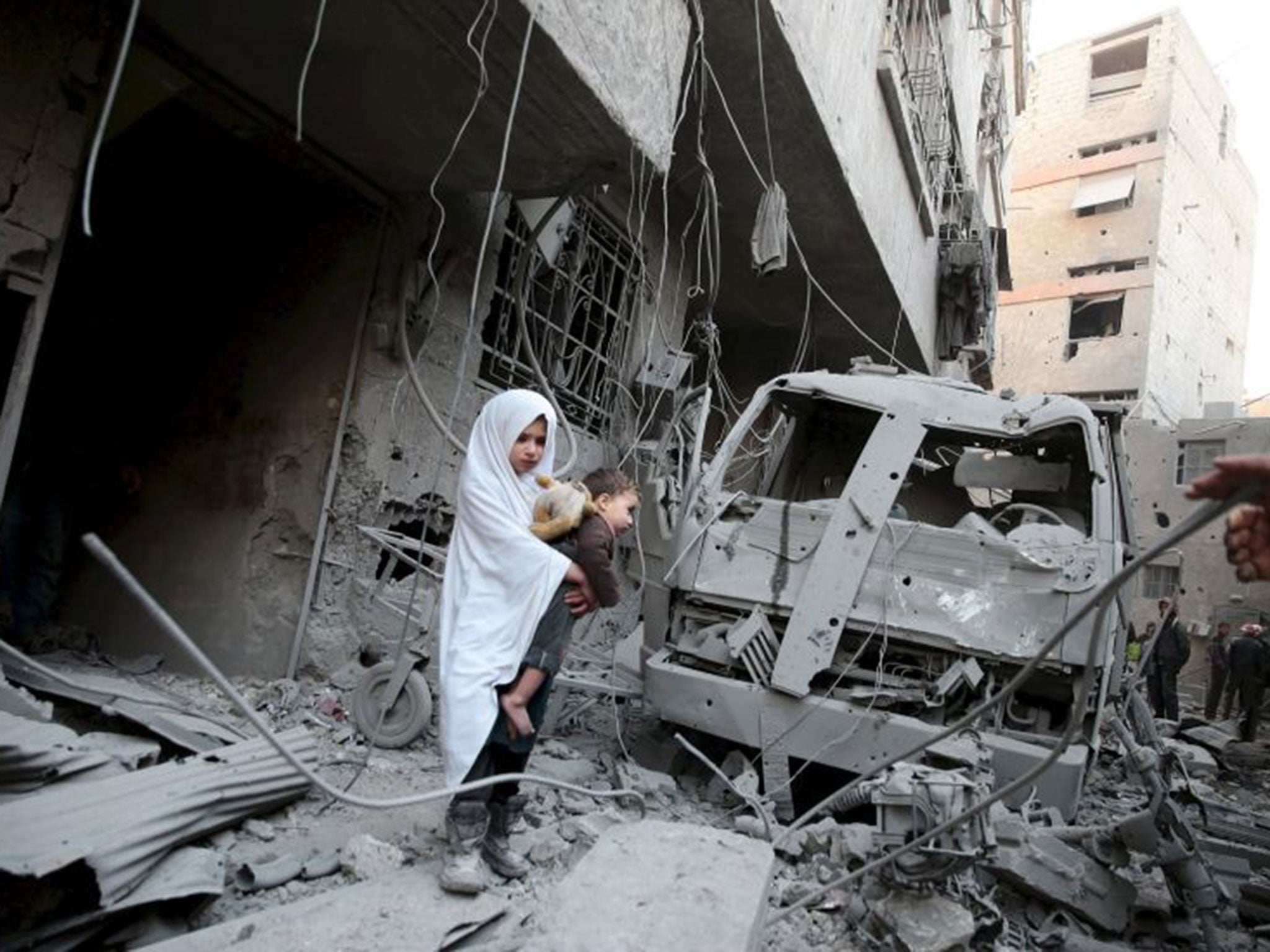 Children amid the ruins of an alleged Russian strike in Douma, near Damascus