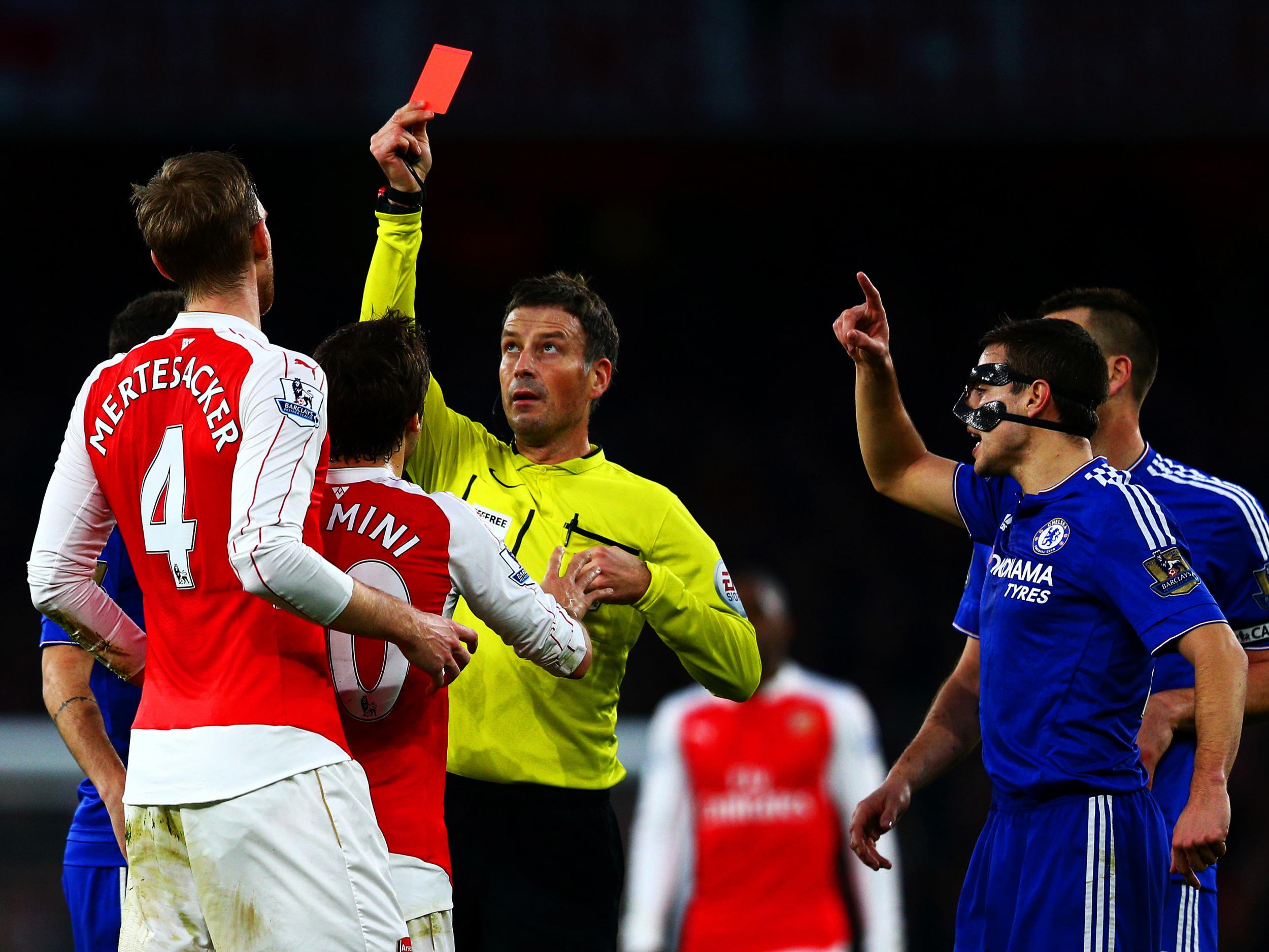 Per Mertesacker is given a rec card against Chelsea
