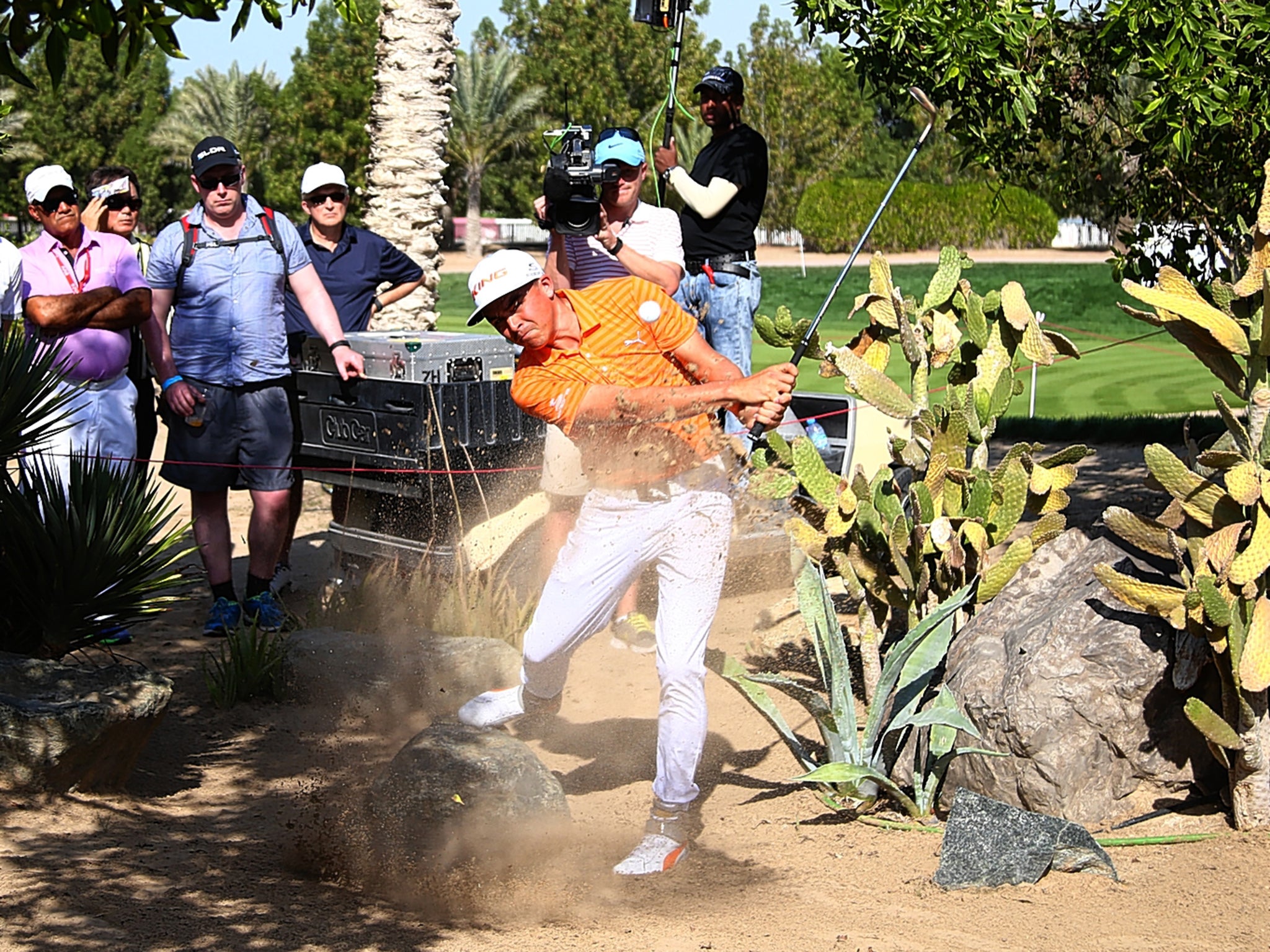 Rickie Fowler hits out of trouble on the seventh hole on his way to victory in the Abu Dhabi HSBC Championship yesterday