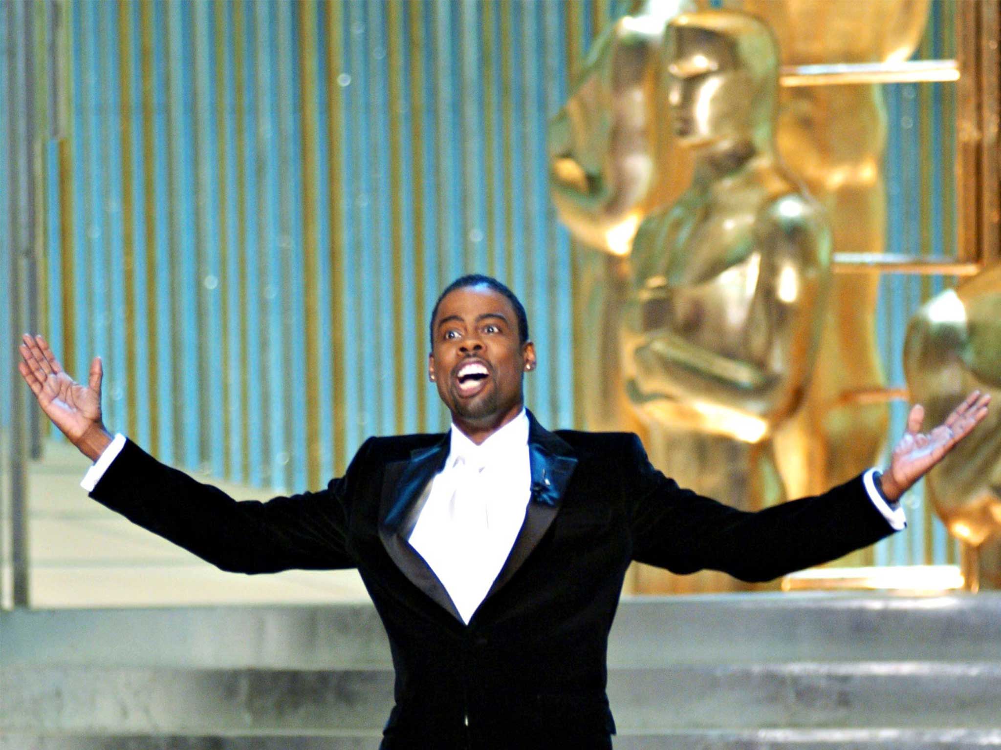 &#13;
Academy Awards host Chris Rock, on stage at the Kodak Theater in 2005, has rewritten his material for this year’s ceremony&#13;