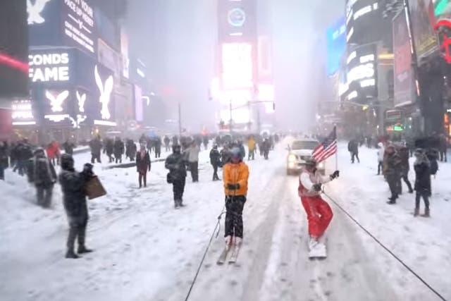Casey Neistat snowboards through Times Square in New York City