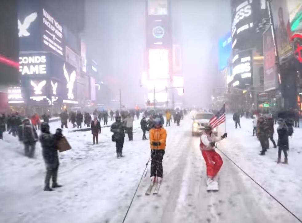 Casey Neistat snowboards through Times Square in New York City
