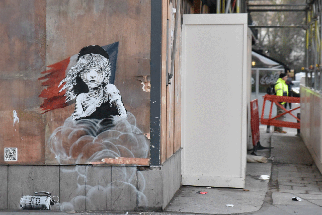 A new Banksy graffiti has appeared opposite French Embassy as a protest over the use of CS gas against refugees