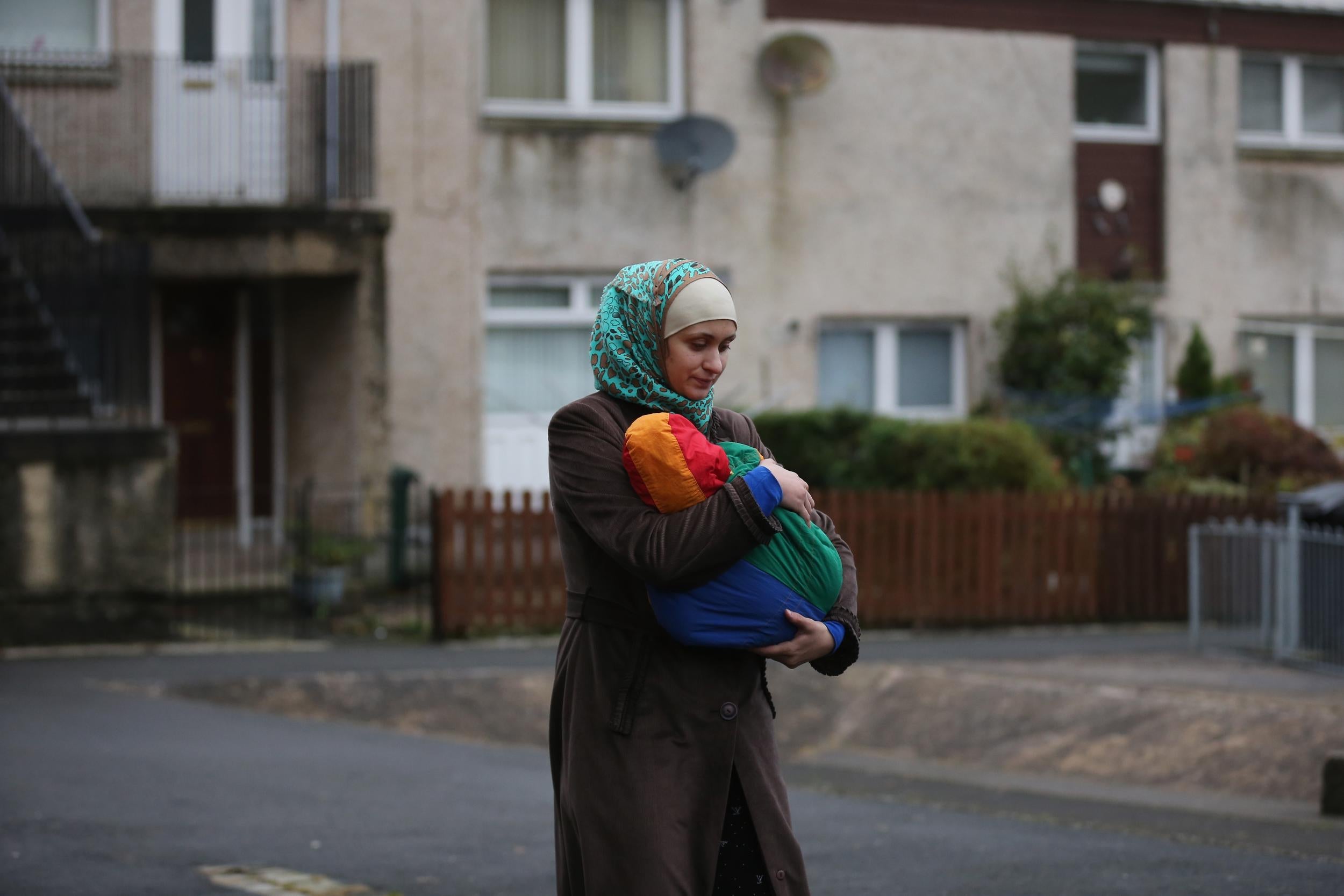 A refugee arrives at her new home in the UK in December, 2015