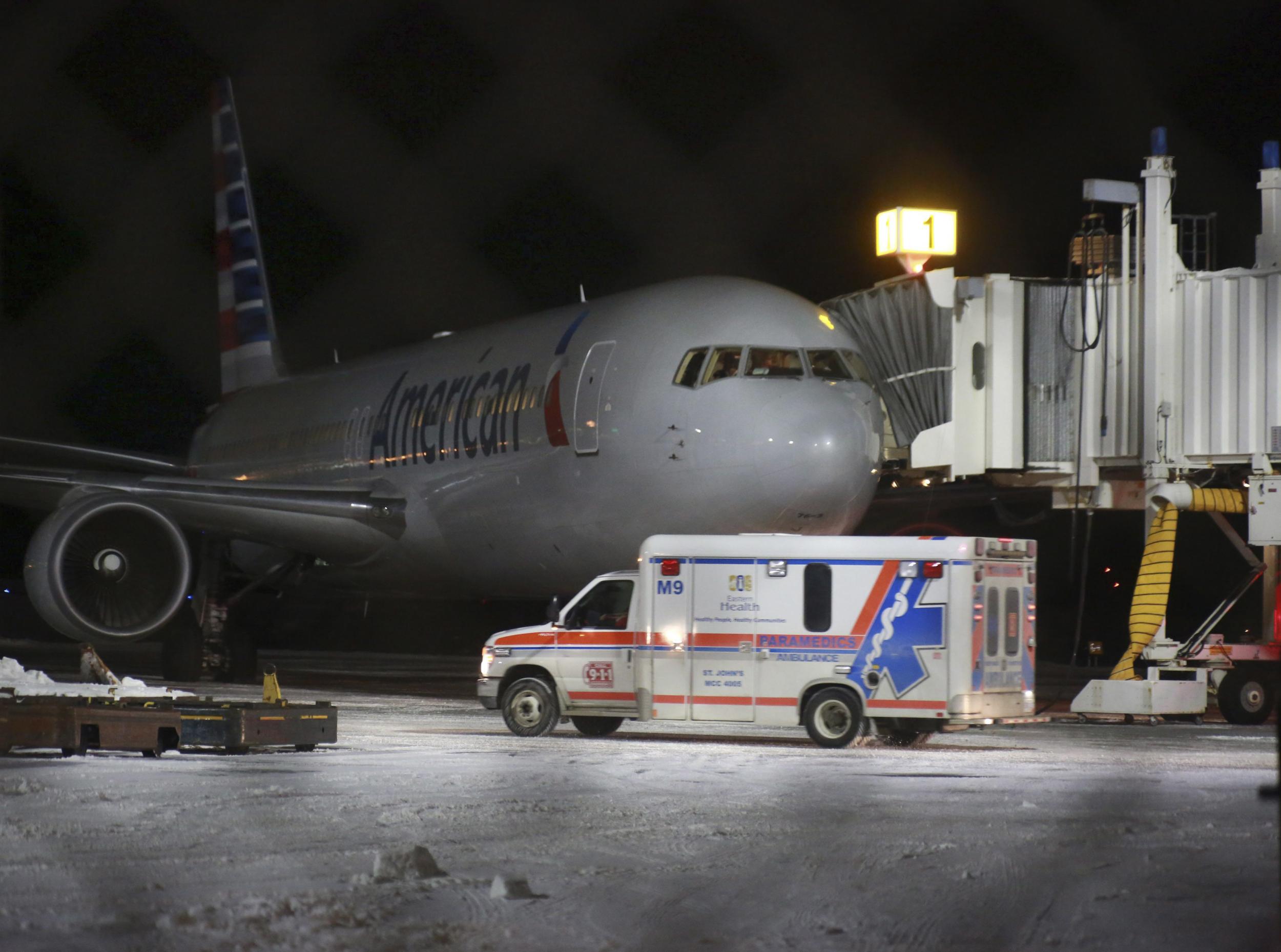 An ambulance next to the plane at St John's International Airport, Newfoundland