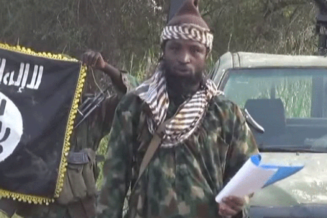 Abubakar Shekau, the former leader of Boko Haram, speaking from a script to announce a "caliphate" in October 2014