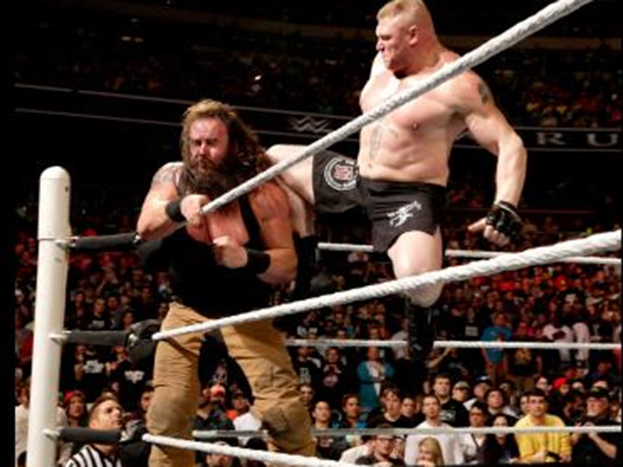 Brock Lesnar hits Braun Strowman with a high knee