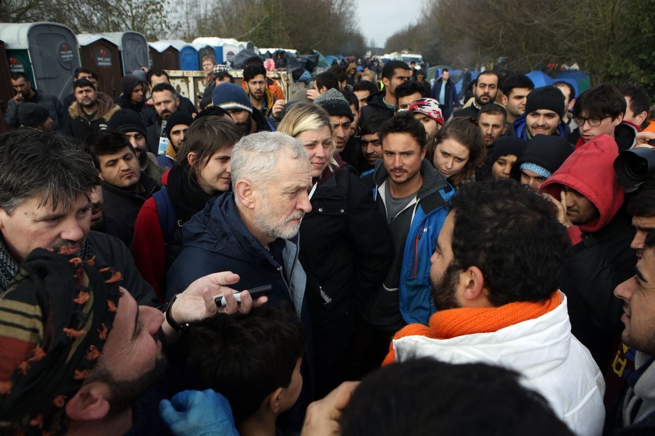 Jeremy Corbyn meets refugees during a visit to the Dunkirk Grand Synthe Camp in France