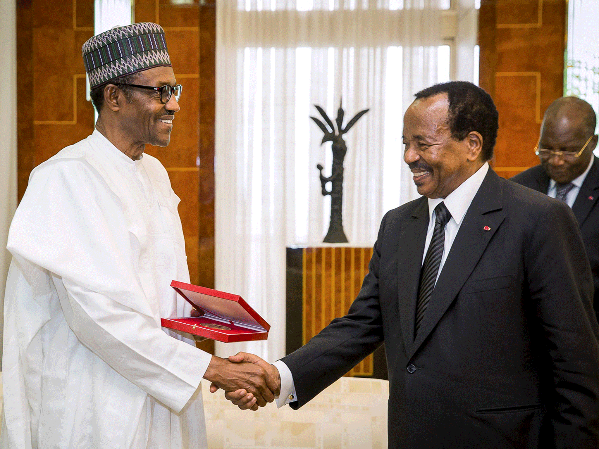 Nigeria's President Muhammadu Buhari(L) shakes hands with Cameroon's President Paul Biya(R) as he arrives on an official visit to Cameroon in Yaounde July 29, 2015.