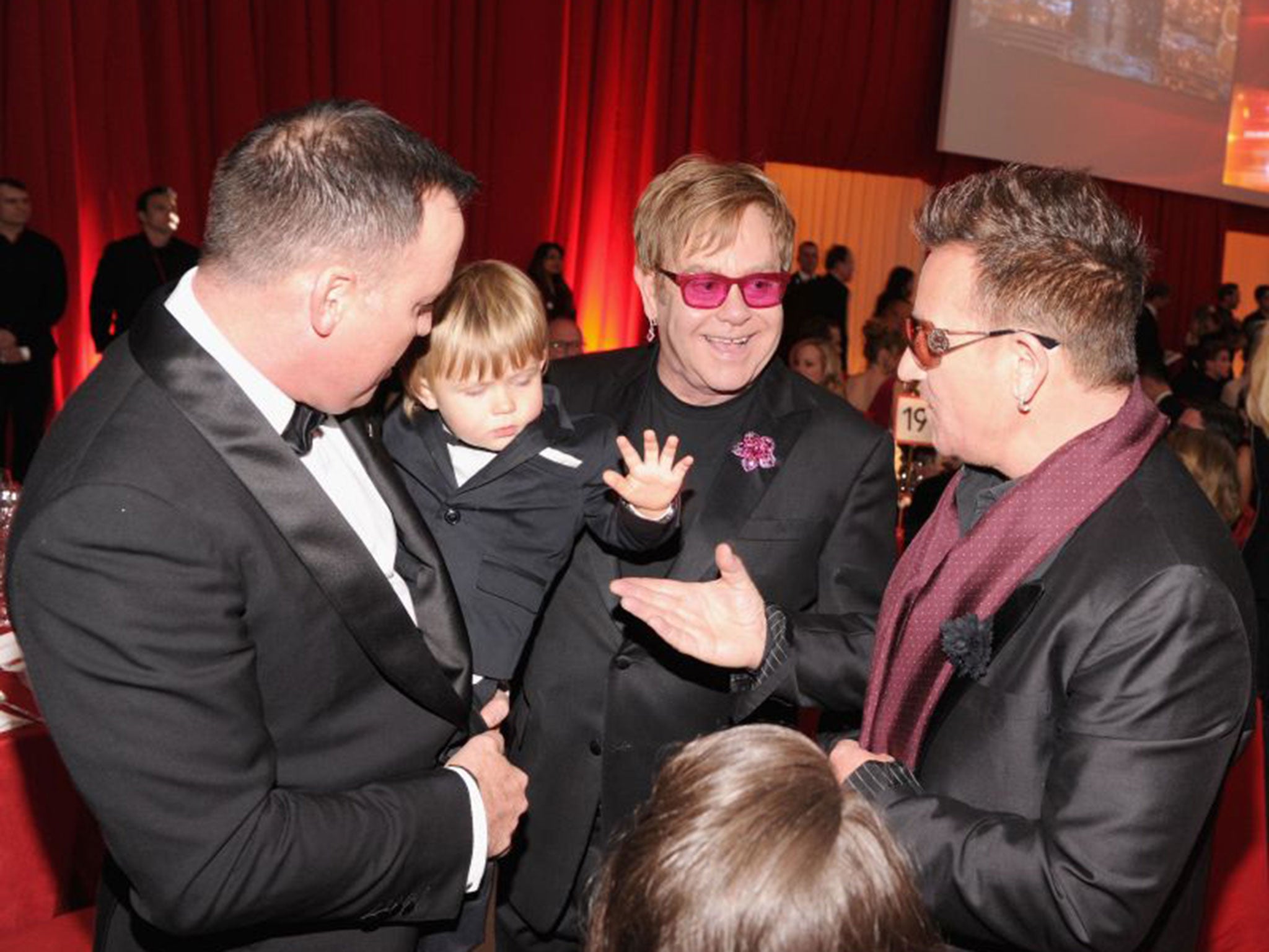 Sir Elton John with his husband, David Furnish, left, their son, Zachary Furnish-John, and U2's Bono