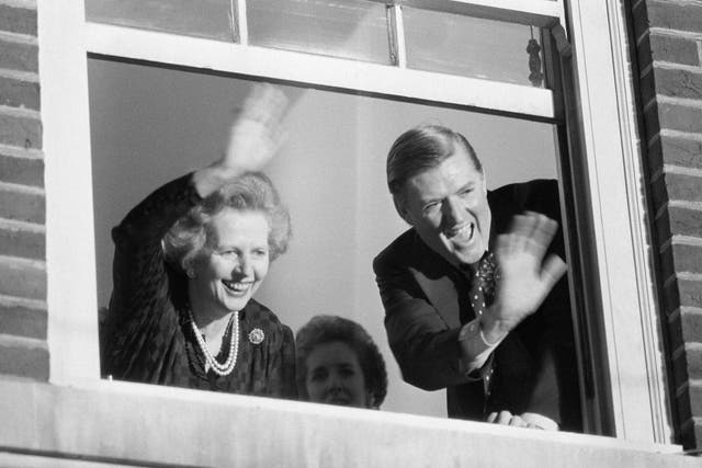 Prime Minister Margaret Thatcher and Conservative Party Chairman Cecil Parkinson wave from party headquarters after their election victory in 1983