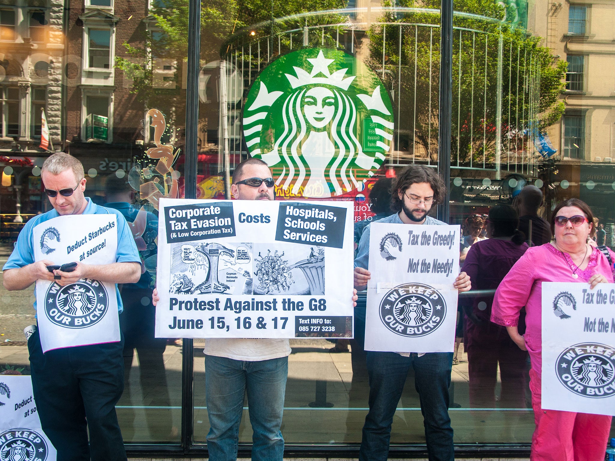 Protesters picket against corporate tax evasion in front of Starbucks on Westmoreland Street in Dublin
