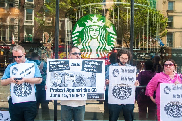 Protesters picket against corporate tax evasion in front of Starbucks on Westmoreland Street in Dublin