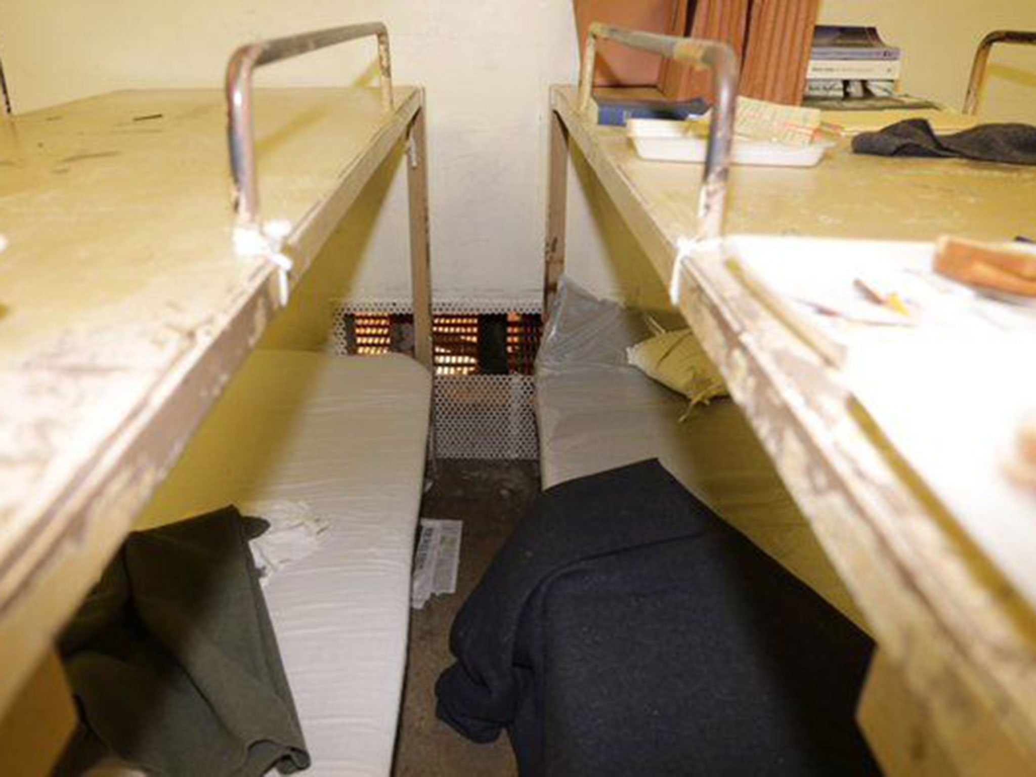 The inmates cut the steel screen between bunk beds as part of their escape plan