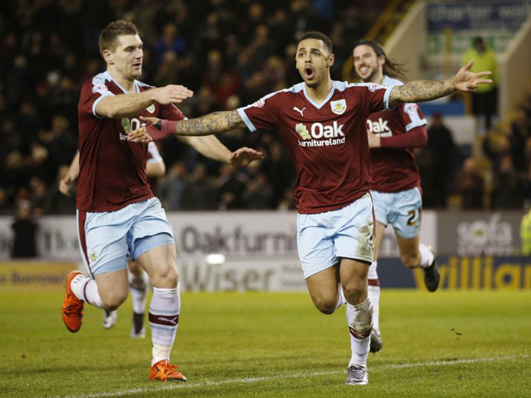 Andre Gray celebrates scoring Burnley’s second goal from the penalty spot