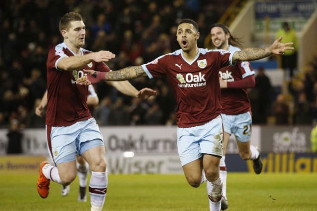 Andre Gray celebrates scoring Burnley’s second goal from the penalty spot