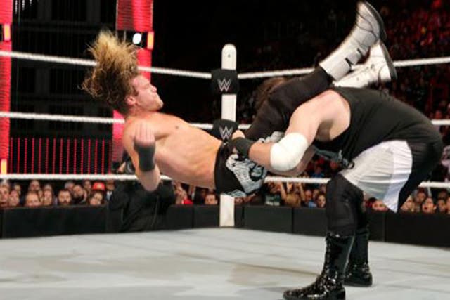 Kevin Owens powerbombs Dolph Ziggler