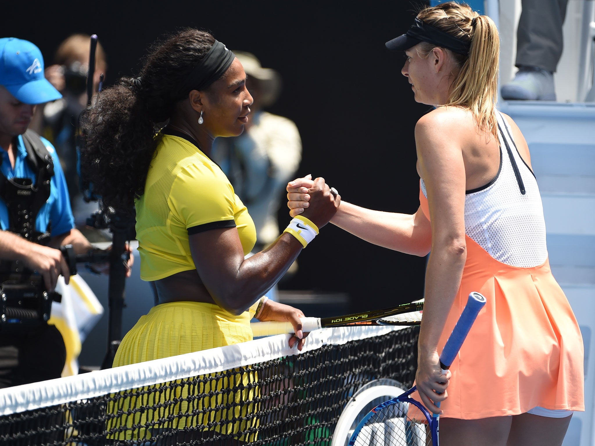 Serena Williams shakes hands with Maria Sharapova after their quarter-final