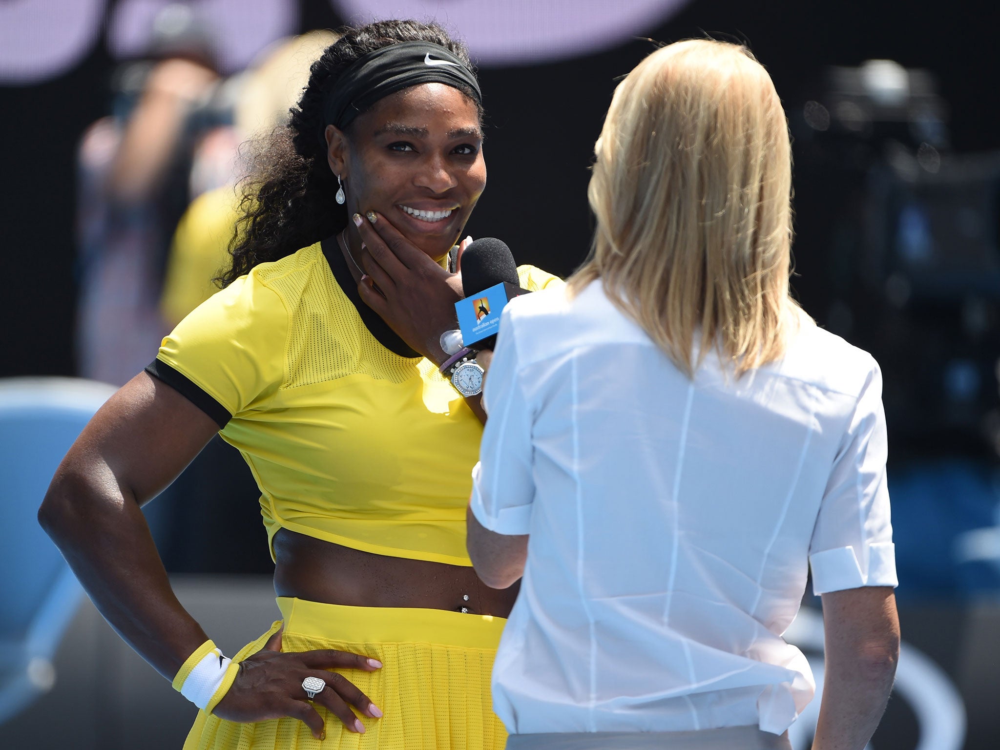 Serena Williams gives an interview on the Rod Laver court after her win over Maria Sharapova