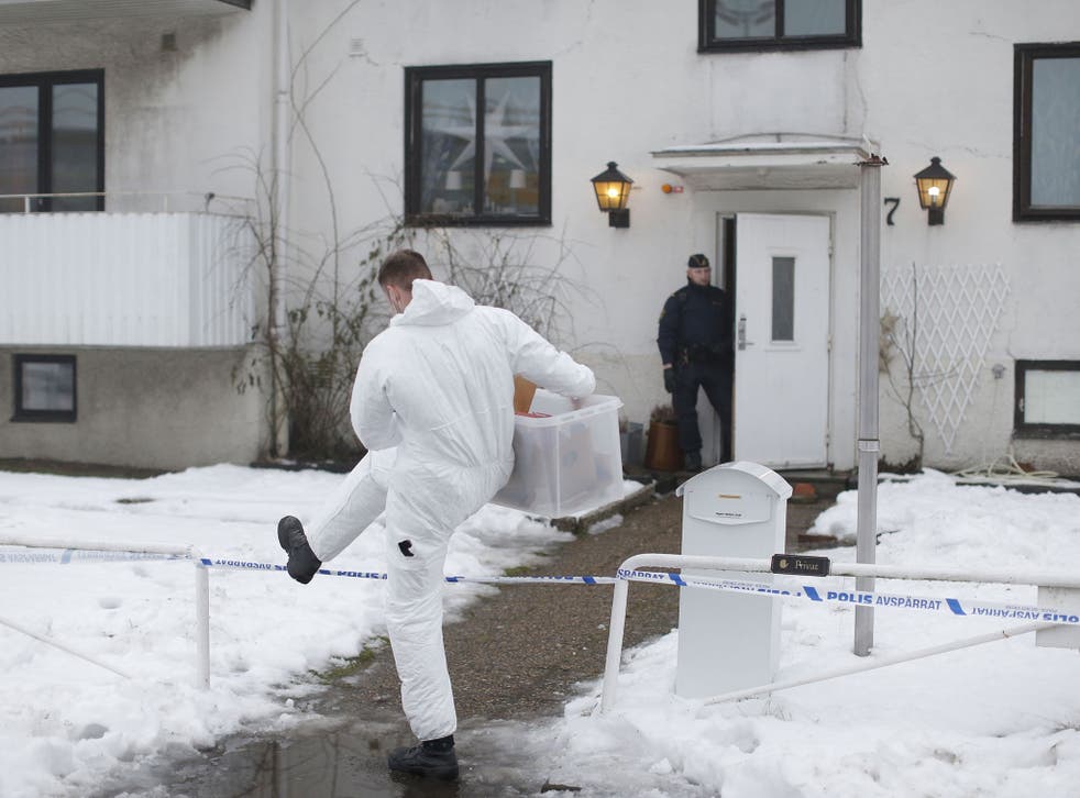 Police investigators are seen outside a home for juvenile asylum seekers in Molndal in south western Sweden on January 25, 2016