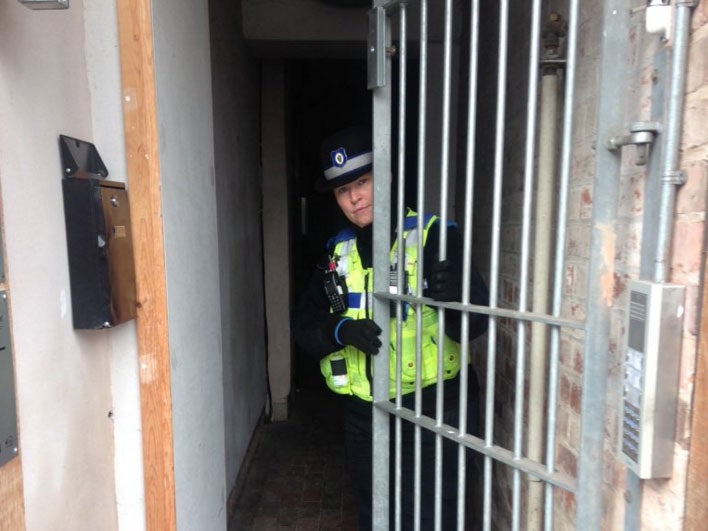 A Coventry city police officer showing an unlocked communal gate