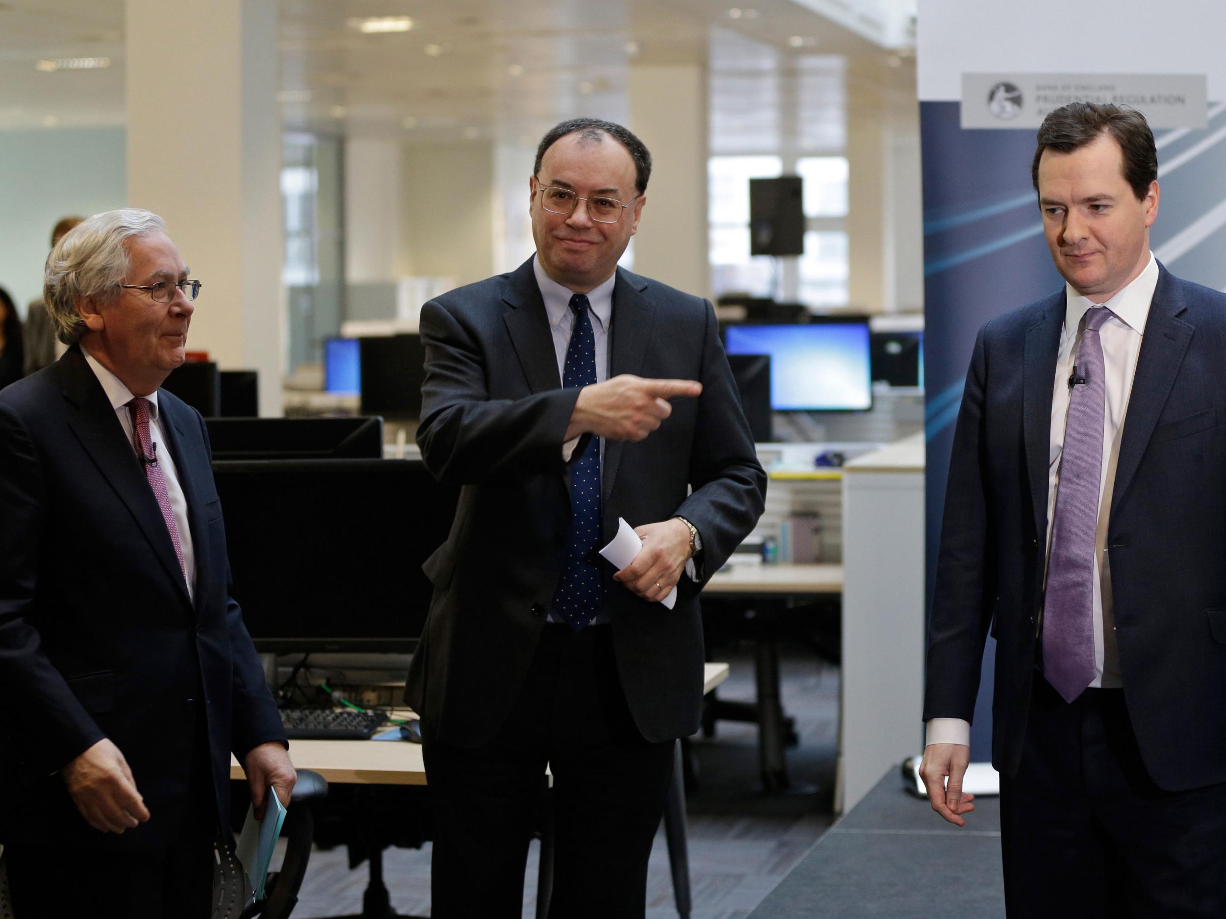 Andrew Bailey, center, the new chief executive of the FCA, points to the exit next to the Chancellor of the Exchequer George Osborne and the Governor of the Bank of England Mervyn King during the opening of the PRA