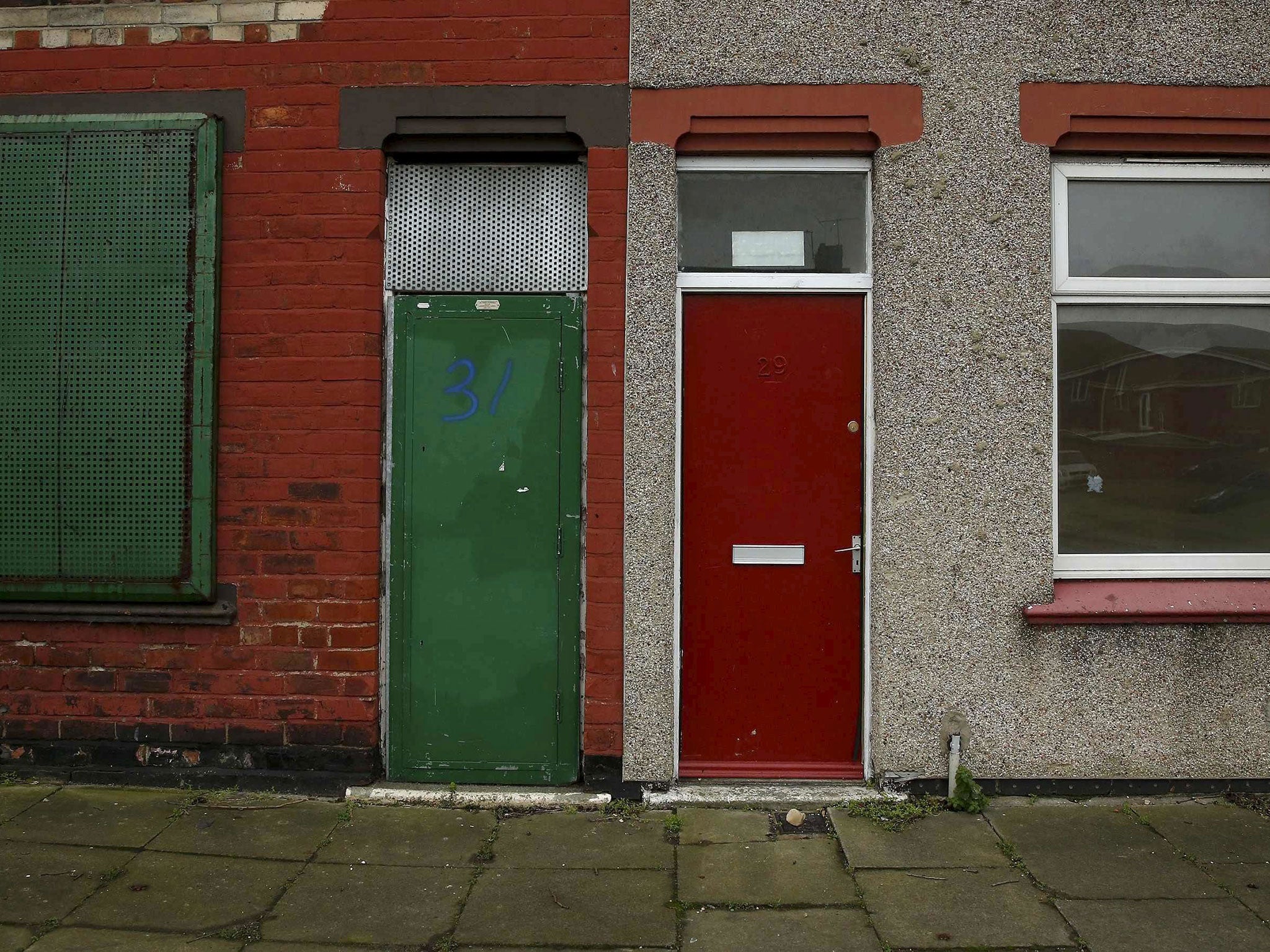 A house with a painted red door is seen on a terraced street in the Gresham area of Middlesbrough, northern Britain, January 20, 2016.