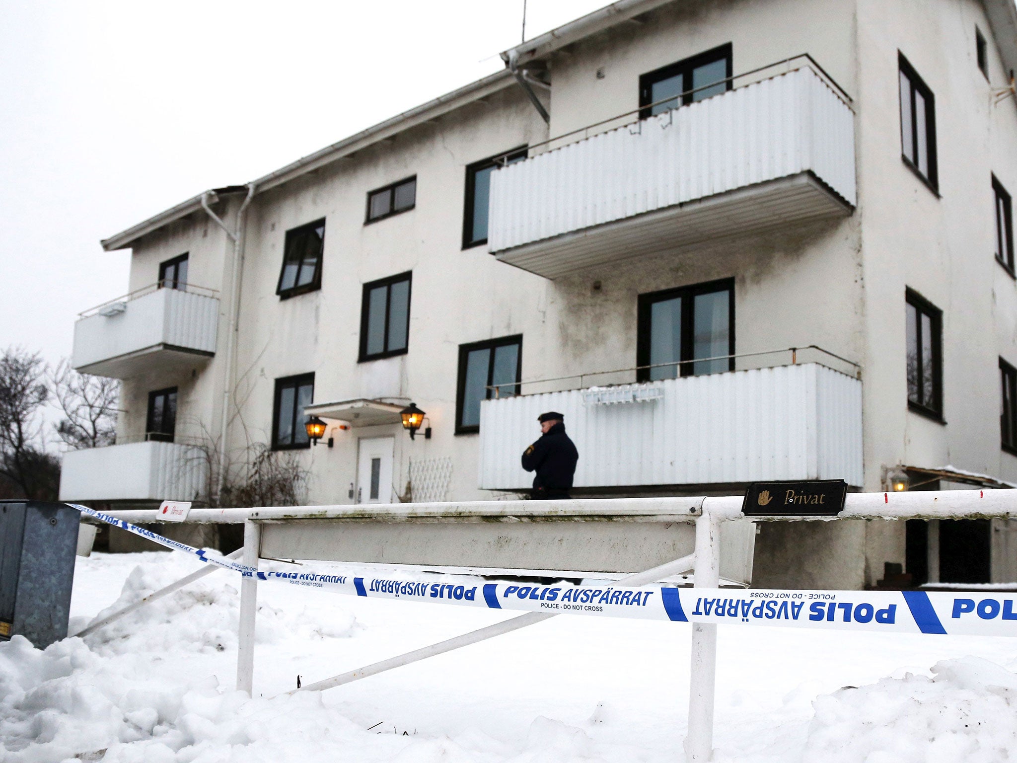 A Police officer is seen outside a home for juvenile asylum seekers in Molndal in south western Sweden on January 25, 2016