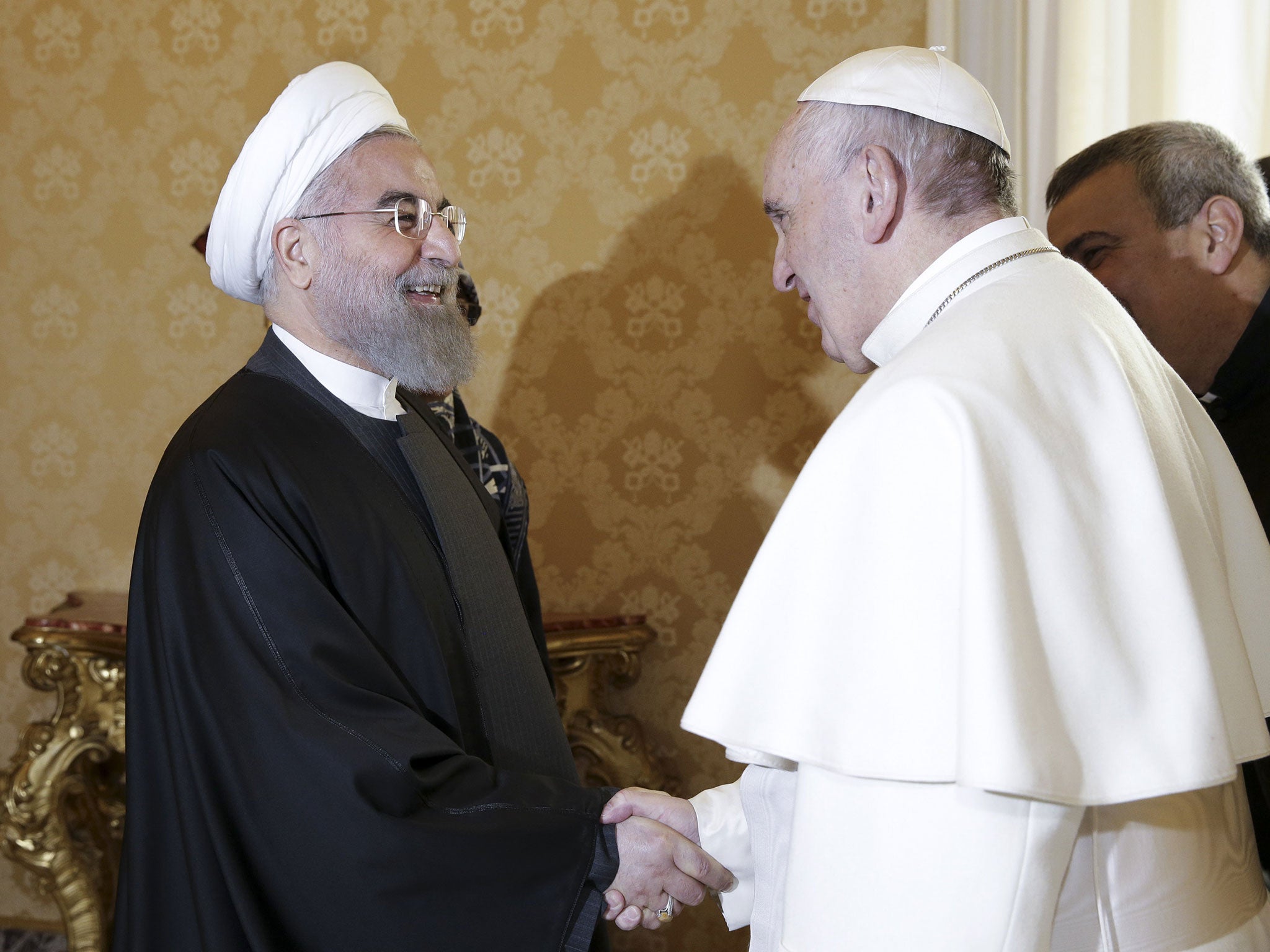 Iran's President Hassan Rouhani (L) is welcomed by Pope Francis at the Vatican January 26, 2016
