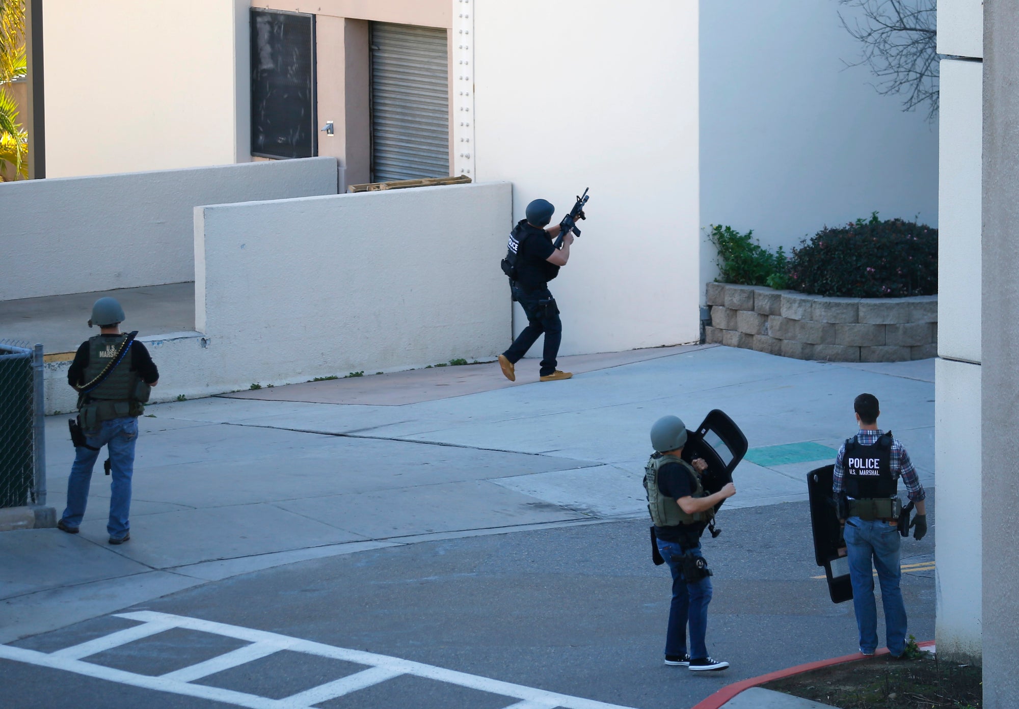 Navy personnel responds to reports of an active shooter situation at the Naval Medical Center in San Diego, California.