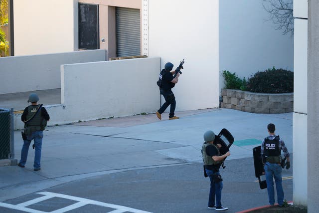 Navy personnel responds to reports of an active shooter situation at the Naval Medical Center in San Diego, California.