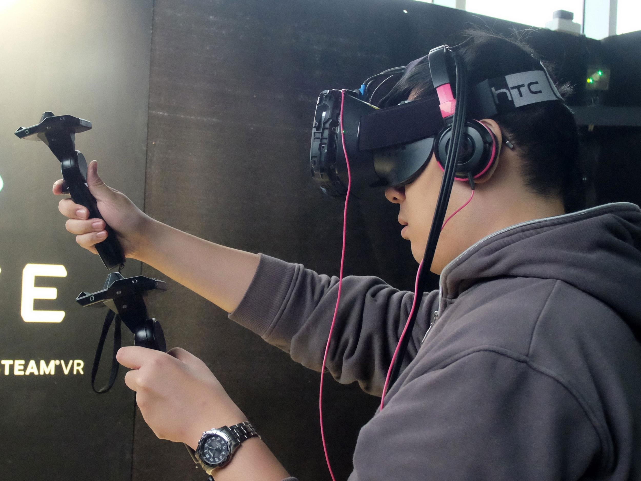 A man uses the HTC Vive at a promotional event in Taiwan
