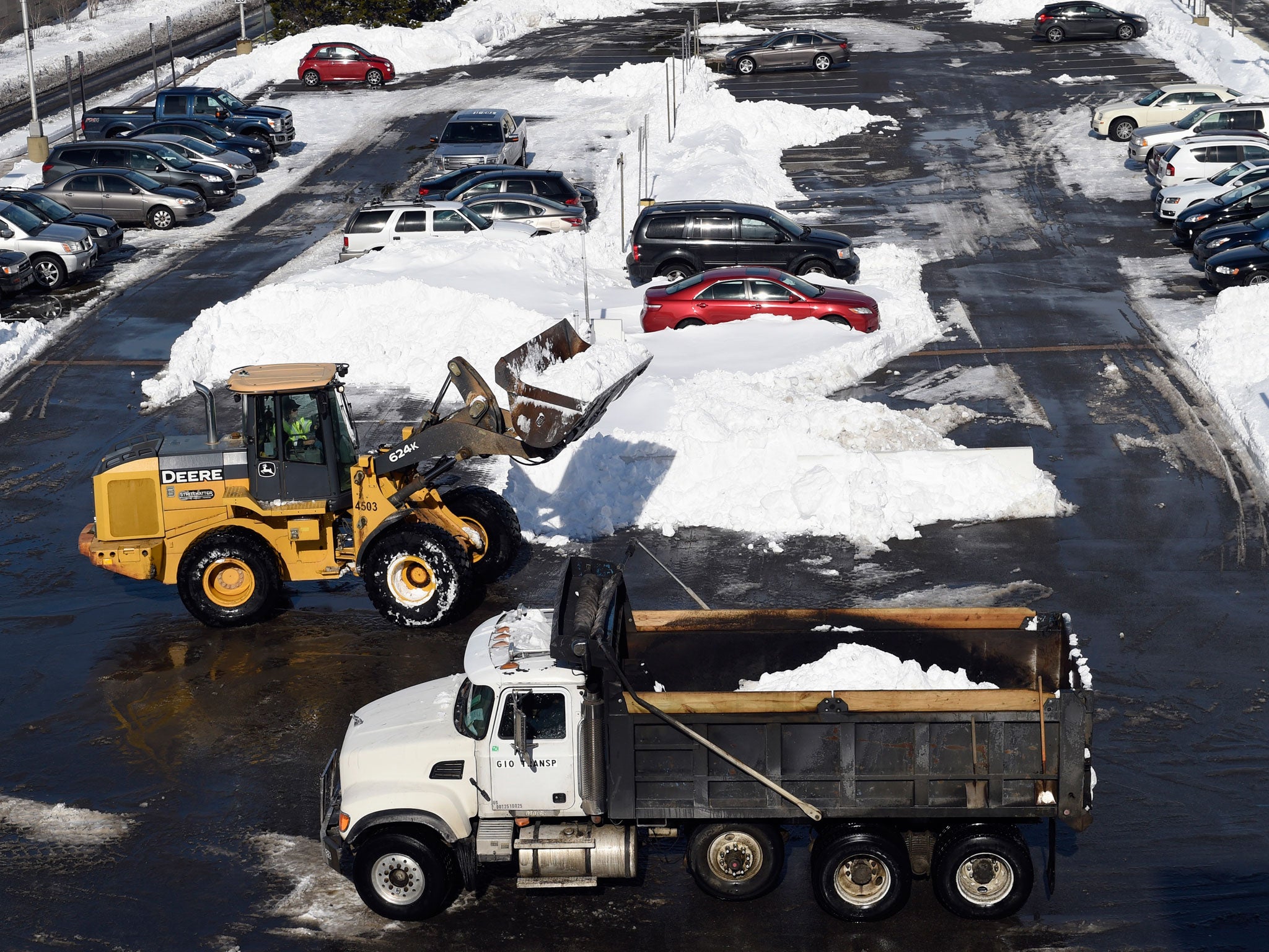 The death struggle for post-blizzard parking is playing out in different ways along the East Coast