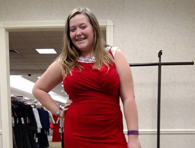 13-year-old Lexi Harris poses in a dress at Dillard's store